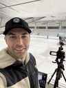 Jake streaming rinkside with camera and tripod